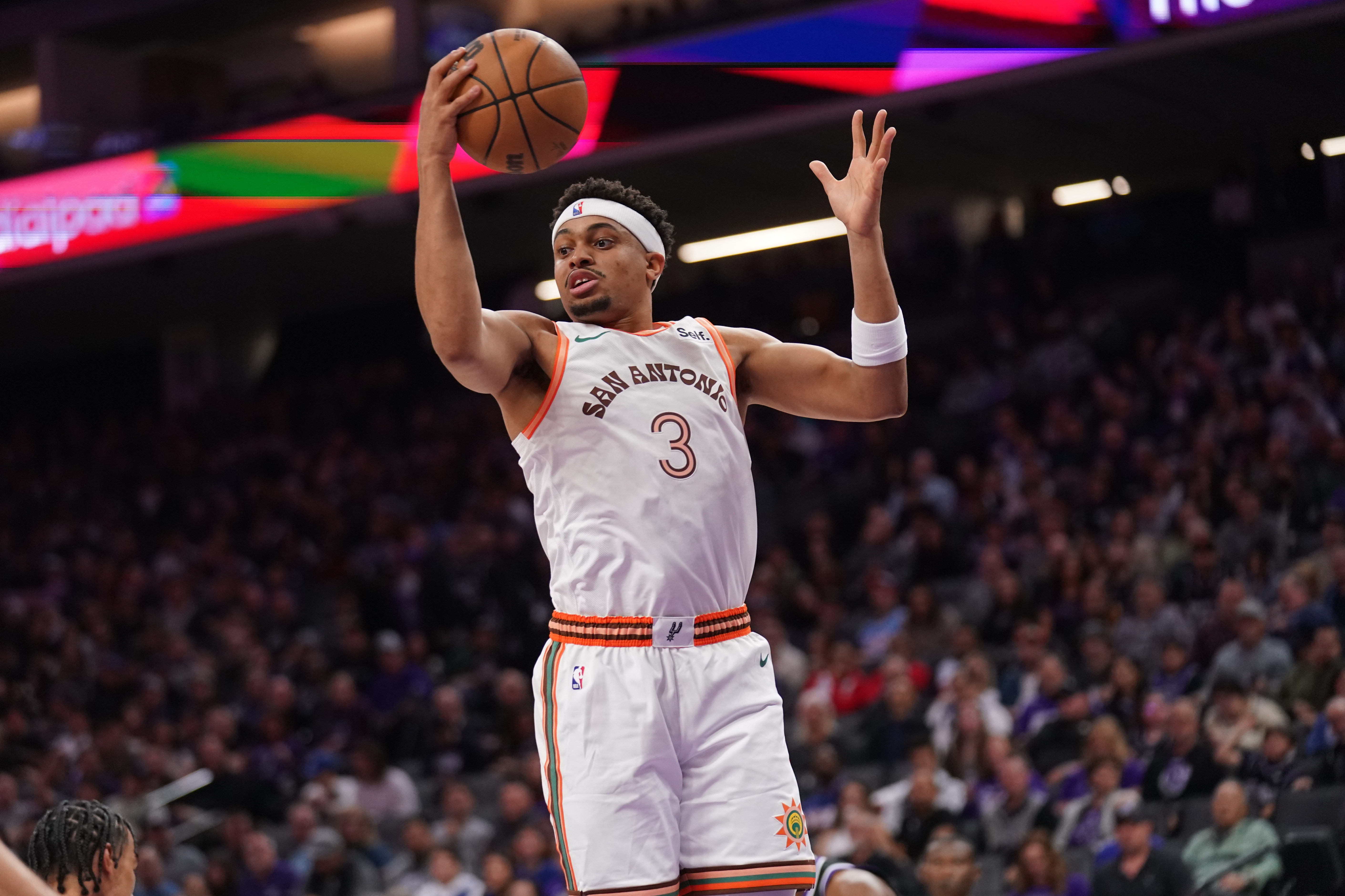 San Antonio Spurs forward Keldon Johnson (3) holds onto a rebound against the Sacramento Kings in the second quarter at the Golden 1 Center.